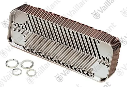 Vaillant Wärmetauscher in rechteckiger Form mit gerillter Oberfläche. Im Vordergrund sind mehrere Unterlegscheiben aus Metall zu sehen.